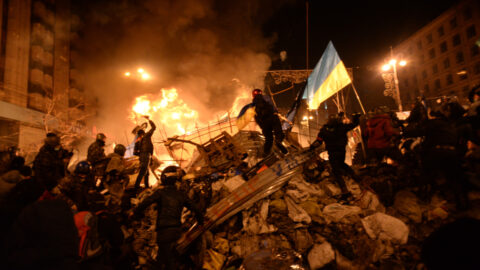 Protesters clash with riot police in central Kyiv during Euromaidan violence on February 18, 2014, marking the first day of deadly escalation