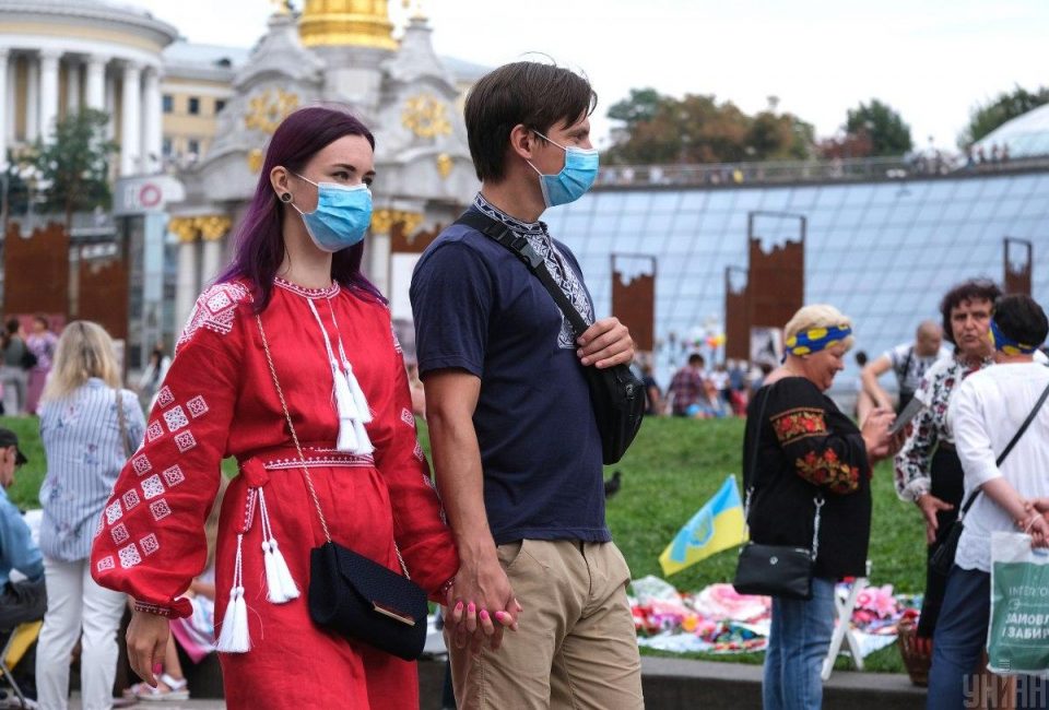 Ukrainian healthcare workers during COVID-19 pandemic in 2020 as rising cases signal approaching autumn surge and system strain