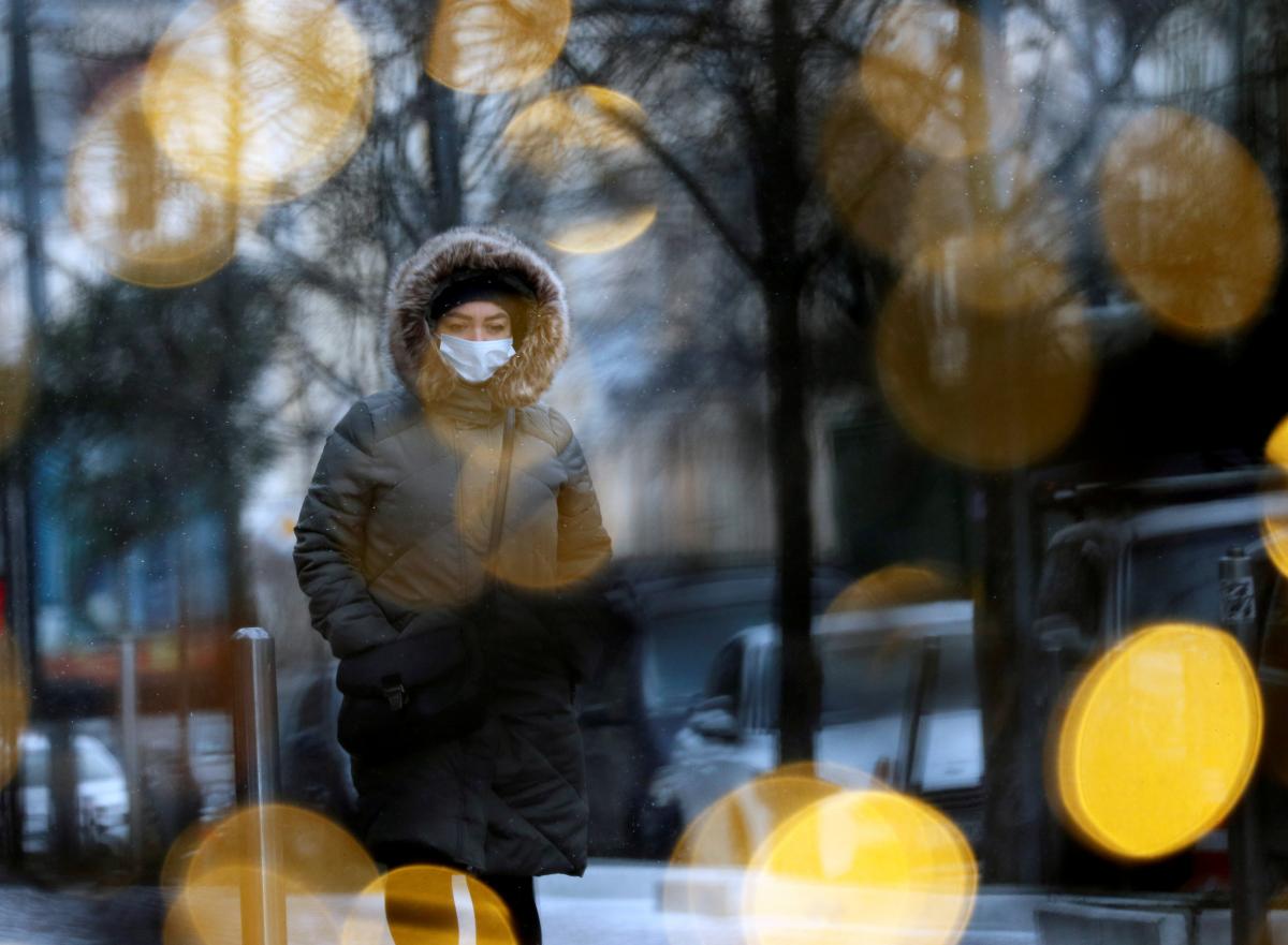 Healthcare workers in Ukraine treating COVID-19 patients in hospital wards during ongoing pandemic wave and health system pressure