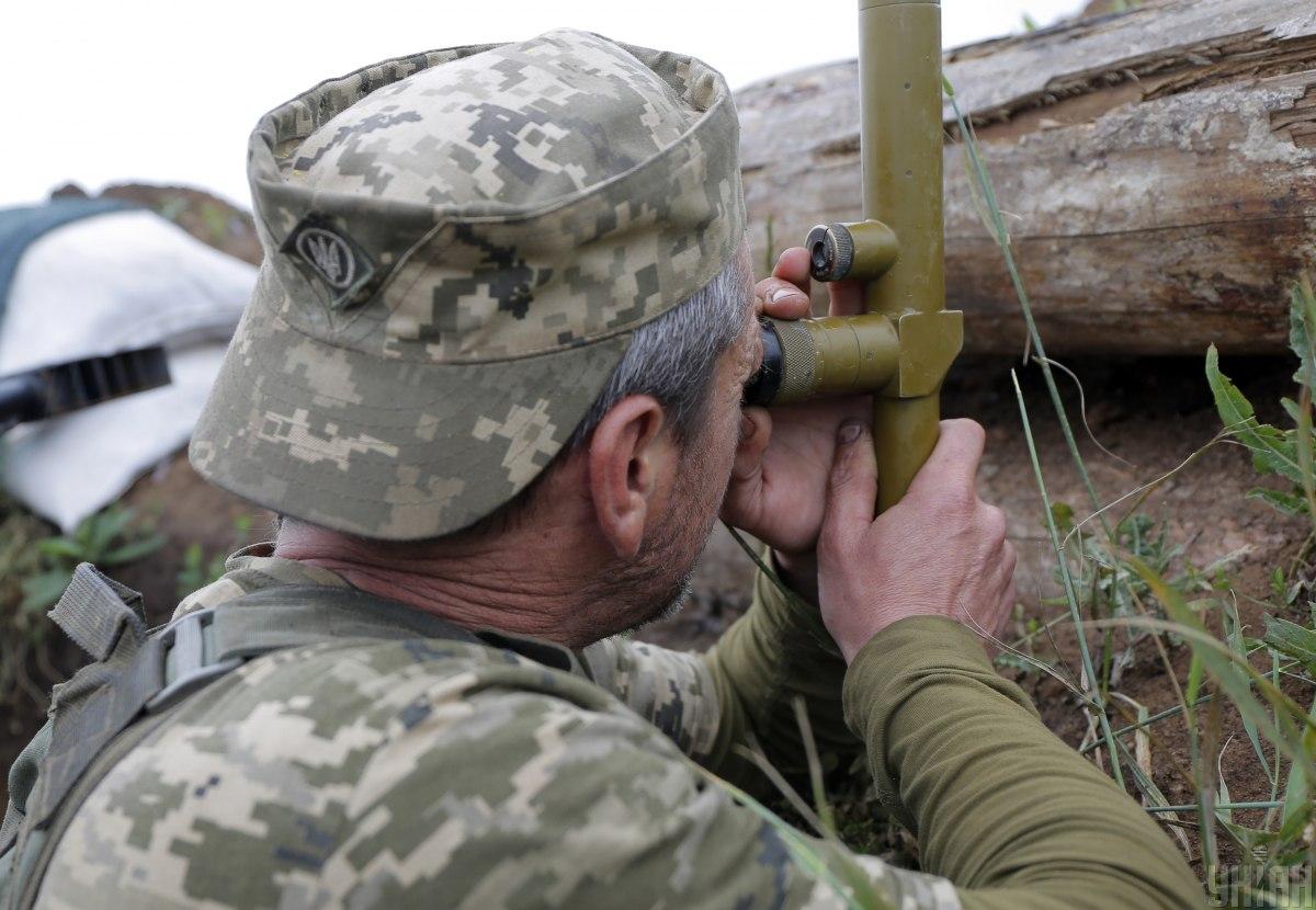 Ukrainian soldiers monitoring frontline positions in Donbas during ceasefire violations and escalating conflict activity in eastern Ukraine April 2021
