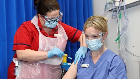 Healthcare workers in Ukraine monitoring COVID-19 data dashboards during pandemic response and hospital coordination efforts