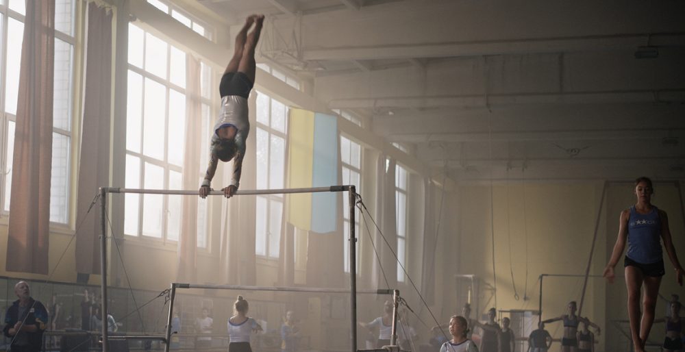 Ukrainian gymnast training in Europe while Euromaidan protests unfold in Kyiv reflecting Olga film Cannes award storyline