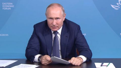 Vladimir Putin speaking on Russian troop buildup near Ukraine border amid rising geopolitical tensions with NATO and Western nations