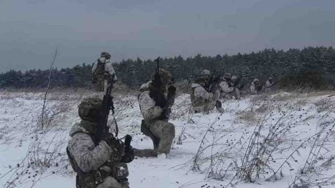Historic February 19 2022 photo of Ukraine frontline with soldiers and armor amid escalating clashes, shelling and mounting Russian buildup near insurgent zones.