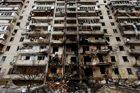 Damaged Kyiv apartment buildings on March 15, 2022 after Russian shelling, with rescue crews and destruction visible in the capital. :contentReference[oaicite:0]{index=0}