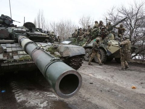 March 8, 2022 Ukraine war scenes with evacuation buses, frontline soldiers, and damage from Russian shelling in a vivid daily war update on empr.media.