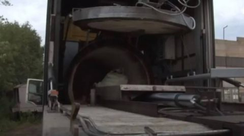 13 mobile crematorium trucks in war‑torn Mariupol removing and burning bodies amidst alleged Russian efforts to hide war crime evidence in 2022.