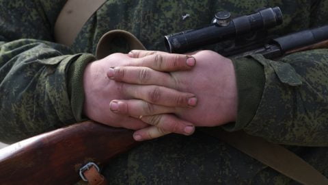 Occupied southern Ukraine under Russian control with looted agricultural fields, smuggling routes, and collaborators alongside occupying forces.