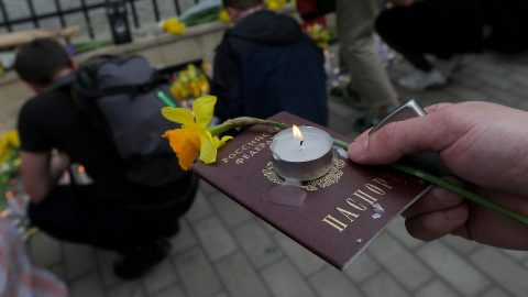 Ukrainian visa stamp on a passport with Kyiv skyline in background, illustrating Ukraine’s new visa regime for Russian citizens and border entry rules.