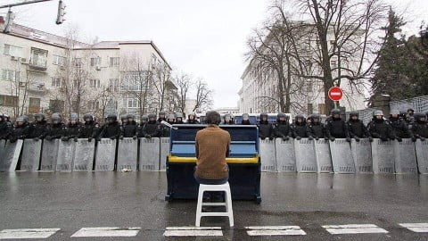 Musicians performing iconic Euromaidan protest songs capturing the Spirit of Maidan — honor, dignity and freedom resonating through Kyiv streets.