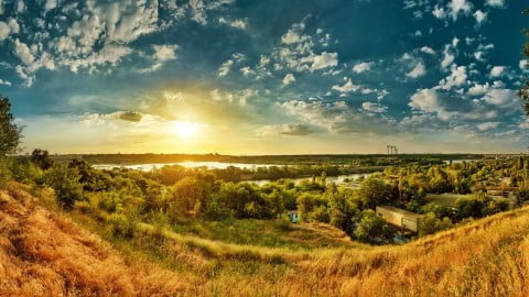 Collage of iconic Ukraine facts: Kyiv skyline, Optimistic Cave, trembita instrument, historical sites, and cultural symbols. EMPR.media