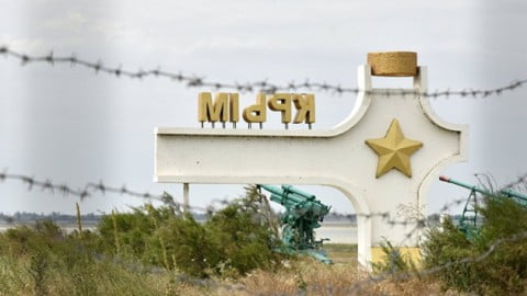 Illustration of Crimea infrastructure sabotage with mined fields, burning forests, polluted water and destroyed utilities symbolizing post‑occupation devastation.