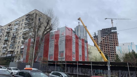 Proposed Ukraine reconstruction zones and high‑rise construction cranes symbolize the controversial housing overhaul law empowering construction monopolists.:contentReference[oaicite:2]{index=2}