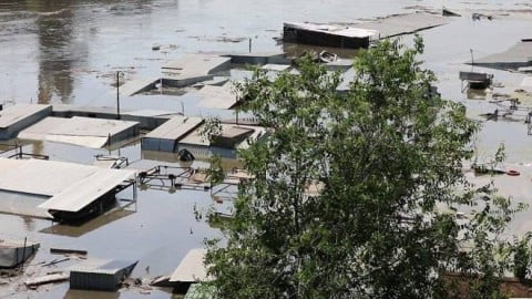 Flooded Kherson left bank after Kakhovka dam blow up with submerged homes, rescue boats and missing people crisis landscapes, Ukraine disaster