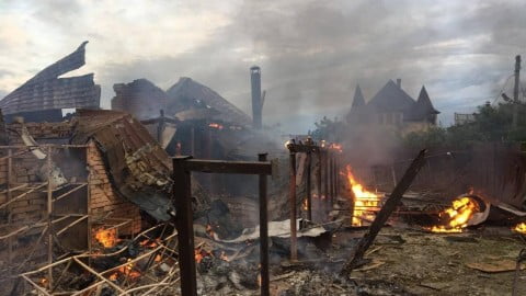 Explosions and smoke rising over Ukrainian landscapes after missile and artillery impacts during extensive regional attacks