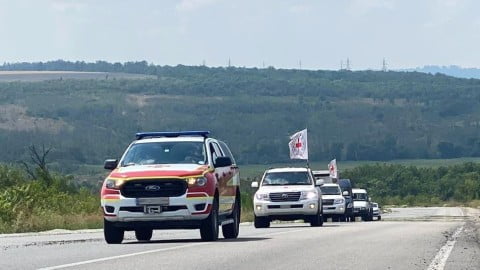 Military transport arrives with the bodies of 64 fallen Ukrainian defenders returned for identification and family burial ceremonies amid the war.