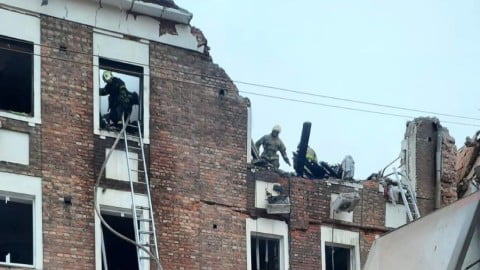 Kharkiv city skyline with emergency response vehicles after a Russian strike, illustrating why no air alert was issued before impact.