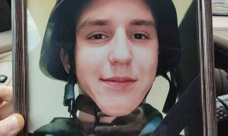 Supporters gather signatures for a petition to posthumously award the title of Hero of Ukraine to a fallen Bakhmut defender amid frontline memorials.
