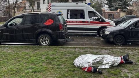 Devastation in Odesa after Russian Iskander ballistic missiles struck a recreational area, leaving destroyed buildings and emergency crews at the scene.