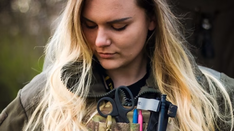 Portrait of Ukrainian combat paramedic Iryna “Cheka” Tsybukh, honored posthumously as a Hero of Ukraine for her frontline service and sacrifice.