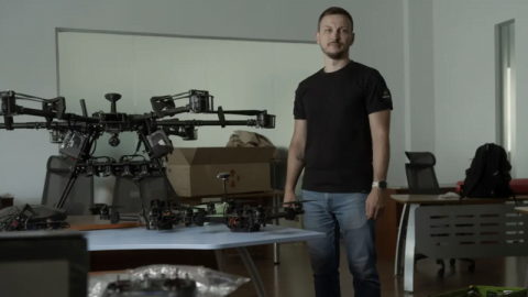 Multiple military drones flying in coordinated swarm formation during test, illustrating autonomous AI-controlled attack capability in modern warfare