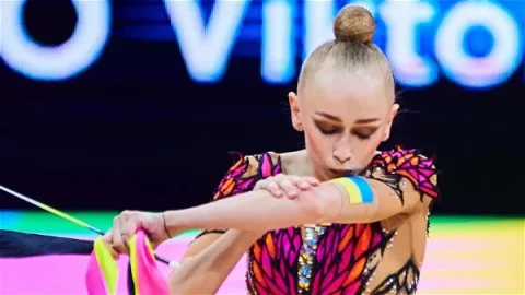 Viktoriia Onopriienko performing rhythmic gymnastics routine at international competition representing Ukraine amid Olympic qualification struggle