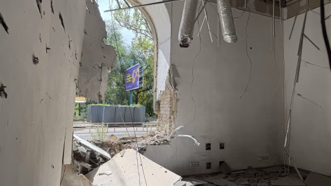 Ukrainian towns under heavy fire showing smoke, damaged buildings and emergency responders amid Russia’s ongoing regional strikes.:contentReference[oaicite:1]{index=1}