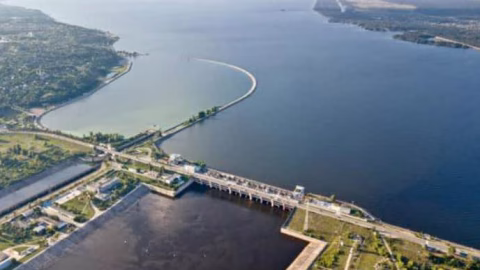 View of the Kyiv Hydroelectric Power Station and dam over the Kyiv Reservoir with water levels and lock infrastructure in view.