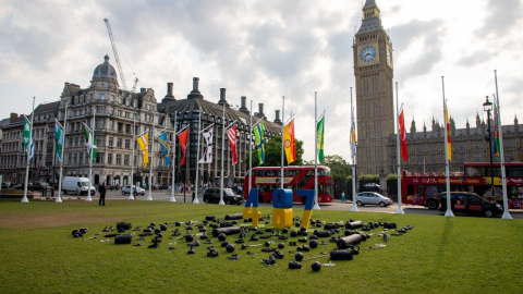 Parliament Square London memorial installation honoring Ukrainian athletes killed in war with Russia featuring symbolic sports equipment