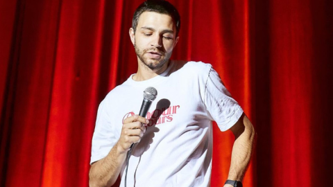Comedian Serhii Chirkov performing on stage before being removed during festival satire of Zelensky campaign promises