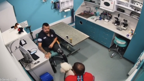 Ukrainian war veteran with prosthetic legs at work in a veterinary clinic, highlighting challenges faced by disabled soldiers reintegrating into civilian life.