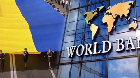The flag of Ukraine against a background of economic graphs showing rising national income and new upper‑middle‑income classification by the World Bank.