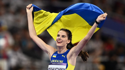 Ukrainian athletes Yaroslava Mahuchikh gold medal and Iryna Herashchenko bronze celebrating high jump Olympic podium Paris 2024