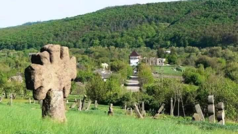Historic Lysivka Hill archaeological site in Busha, Ukraine with ancient Trypillian remains and Cossack cemetery threatened by mineral extraction sale.