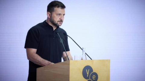 Ukrainian President Volodymyr Zelensky speaking at an international forum, criticizing global partners as Belarus intercepts Russian Shahed drones. :contentReference[oaicite:2]{index=2}