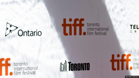 Protesters and media outside the Toronto International Film Festival venue around *Russians at War* documentary screening controversy and cancellation.