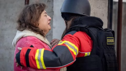 Devastation after Russia’s massive missile and drone attack on Ukraine with smoke rising over damaged infrastructure and emergency response teams at work.