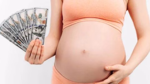 Ukrainian family with newborn celebrating as new law raises one-time childbirth benefit to 50,000 UAH and expands monthly child support from 2026. :contentReference[oaicite:2]{index=2}