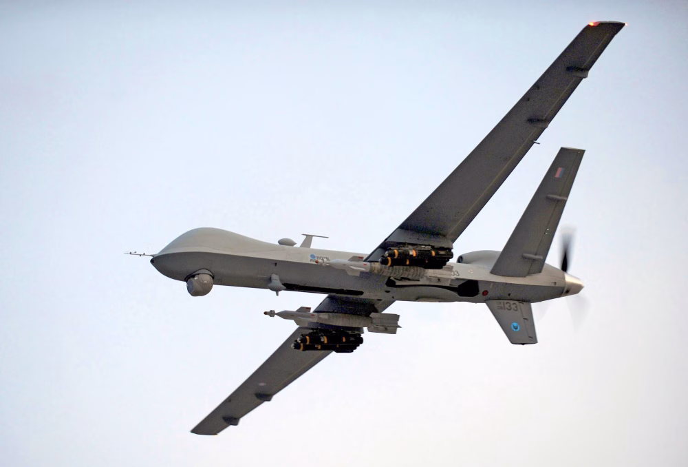 Spectator M1 reconnaissance drone equipped with Ukrainian-developed AI system soaring over terrain, representing advanced autonomous defense technology.