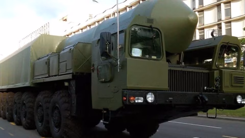 Russian Oreshnik hypersonic intermediate‑range ballistic missile in flight against a cloudy sky, representing looming threats to Ukrainian territory.