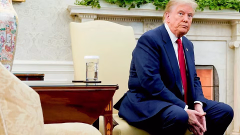 US President Donald Trump at a press briefing with a visual overlay of Ukraine’s vast mineral and natural resource fields worth trillions of dollars.