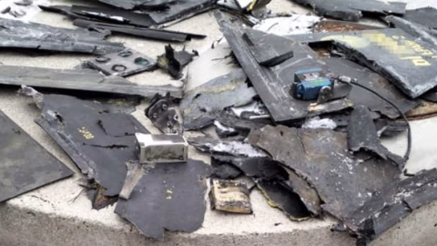 Damage to the Chornobyl New Safe Confinement structure after a Russian drone strike with responders inspecting the compromised nuclear shelter site.
