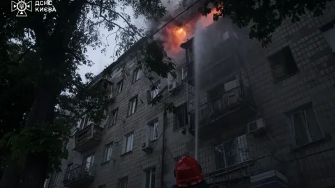 Emergency responders at the scene in Kyiv after a Russian night attack that killed two civilians and injured five, including four children.