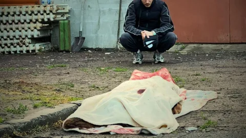 Damaged residential building and rescue workers after a massive Russian attack on Kyiv region that killed civilians and caused widespread destruction. :contentReference[oaicite:1]{index=1}
