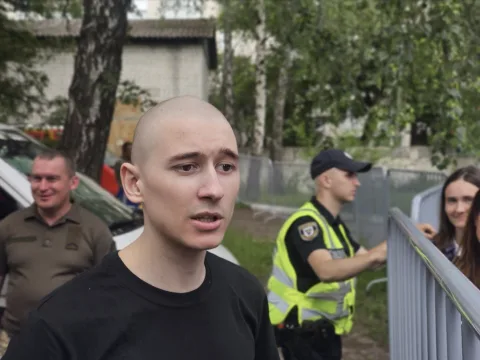 Portrait of Mariupol defender Valeriy recently released from Russian captivity, holding hope and longing for family after years of imprisonment.