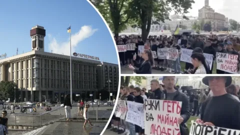 Large crowd of protesters in central Kyiv during the first major anti-war rally of the full-scale conflict, holding banners and flags