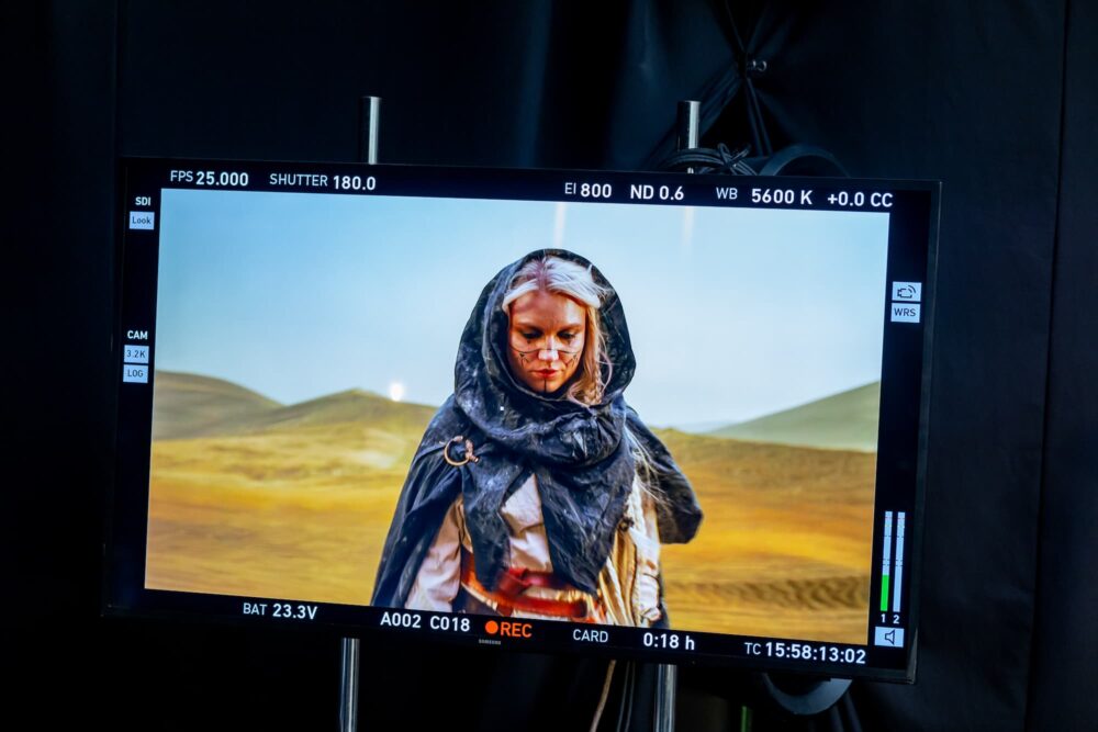 Kelsie Kimberlin performing with Ukrainian imagery in the Dream of Peace music video, symbolizing hope, resilience and unity for freedom.