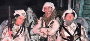 Ukrainian volunteer fighters moments before a combat mission on Christmas night, symbolizing resolve, unity, and sacrifice