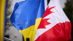 Canadian flag and Ukrainian flag together – symbol of military aid to Ukraine 2025