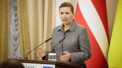Denmark Prime Minister with Danish flag – military aid decision 2025